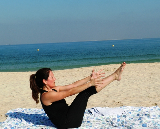 Julie Campos Farmer doing yoga on the Umm Suqeim beach in Dubai