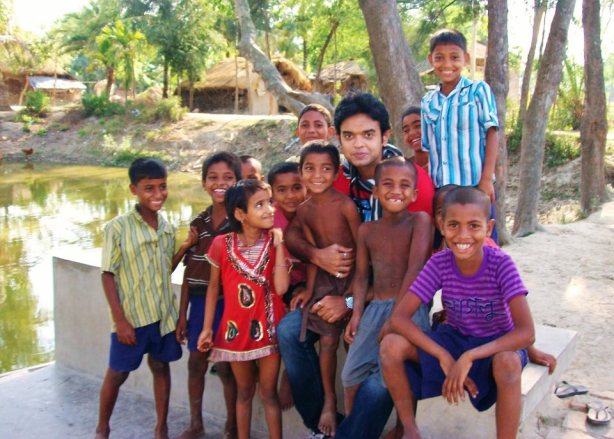 Bobby posing with local kids at Sunderban