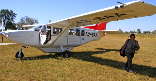 Chandrani in front of a 6-seater bush plane in Botswana
