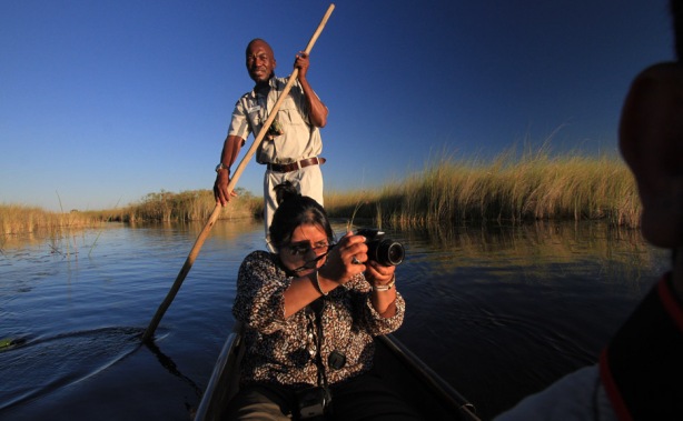 Chandrani rides a Mokoro in crocodile and hippo infested waters in Botswana